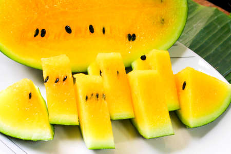 Yellow flesh watermelon cut and serve creatively.の写真素材