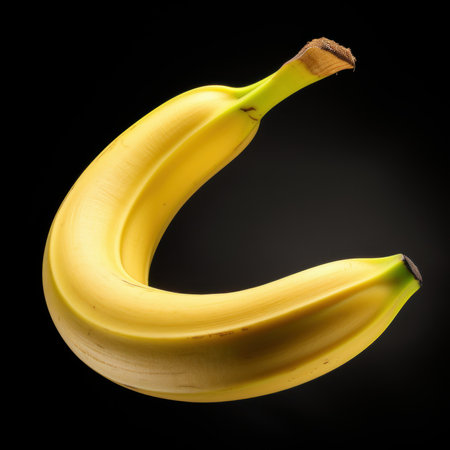Banana on black background, close-up, studio shot.の素材