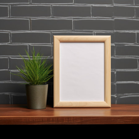 Wooden frame mockup with plant in pot on brick wall backgroundの素材