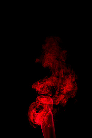 Red smoke abstract on black backgroundの写真素材