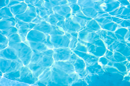 Blue water in swimming pool background