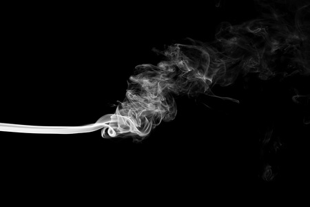 White smoke isolated on black backgroundの写真素材