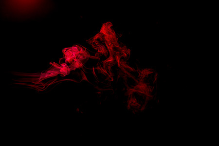 Red smoke abstract on black backgroundの写真素材