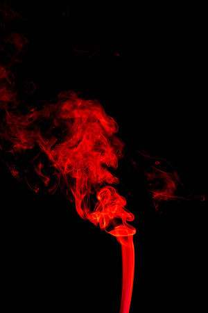 Red smoke abstract on black backgroundの写真素材