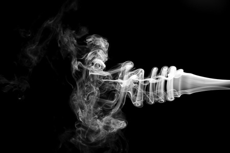 White smoke isolated on black backgroundの写真素材