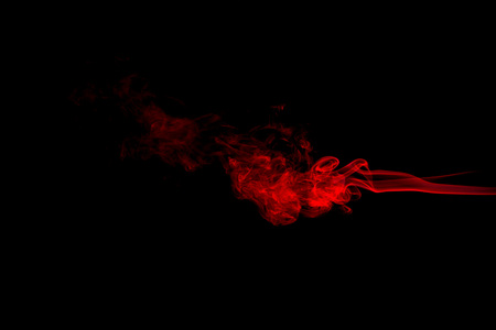 Red smoke abstract on black backgroundの写真素材