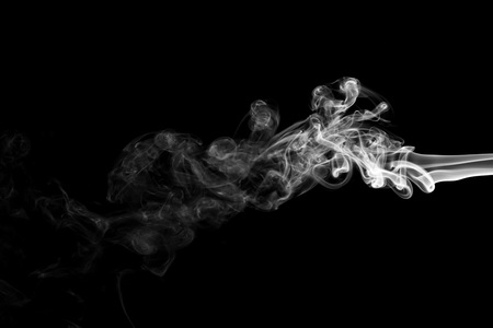 White smoke isolated on black backgroundの写真素材