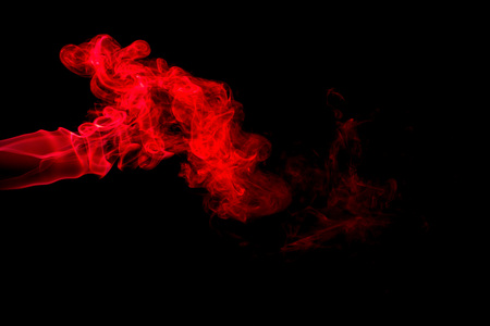 Red smoke abstract on black backgroundの写真素材