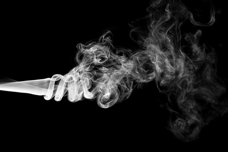 White smoke isolated on black backgroundの写真素材