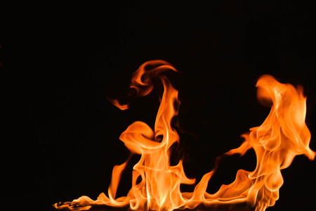 Abstract fire flames on a black background.