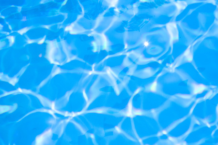 Ripple water in swimming pool sun reflectionの写真素材