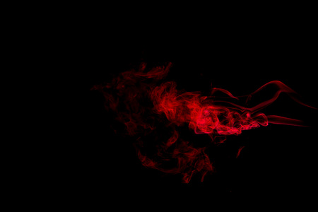 Red smoke abstract on black backgroundの写真素材