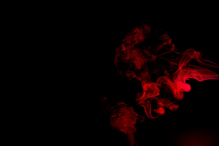 Red smoke abstract on black backgroundの写真素材