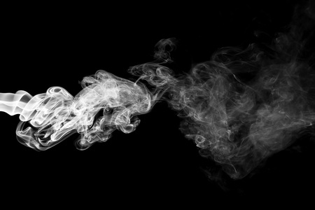 White smoke isolated on black backgroundの写真素材
