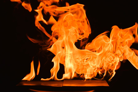 Abstract fire flames on a black background.