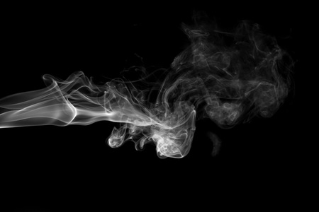 White smoke isolated on black backgroundの写真素材