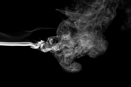 White smoke isolated on black backgroundの写真素材