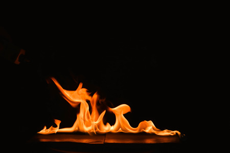 Abstract fire flames on a black background.
