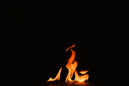 Abstract fire flames on a black background.