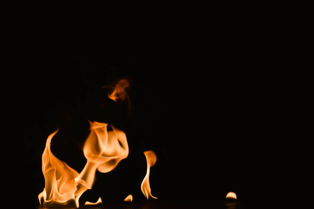 Abstract fire flames on a black background.