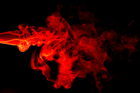 Red smoke abstract on black backgroundの写真素材