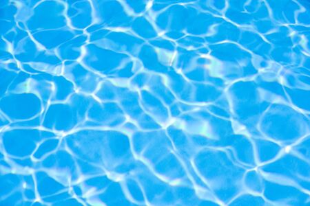 Water in swimming pool blue backgroundの写真素材