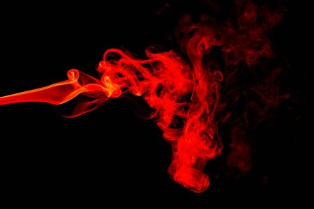 Red smoke abstract on black backgroundの写真素材
