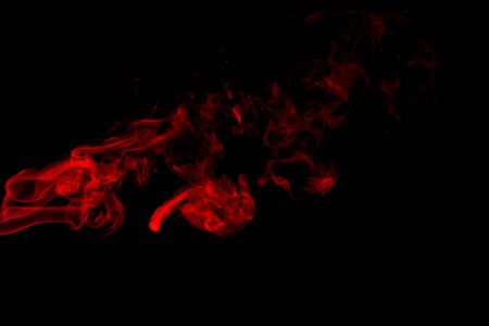 Red smoke abstract on black backgroundの写真素材
