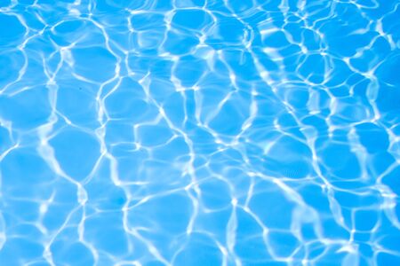 Ripple water in swimming pool sun reflectionの写真素材