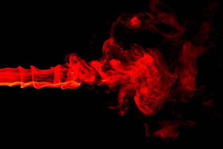 Red smoke abstract on black backgroundの写真素材