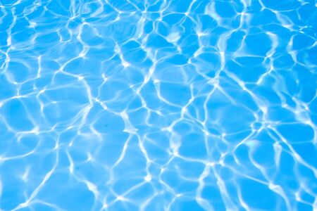 Ripple water in swimming pool sun reflectionの写真素材