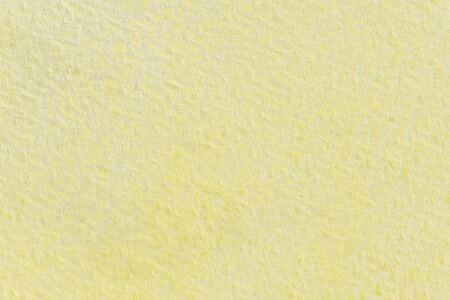 Abstract yellow watercolor painting textured on white paper backgroundの写真素材