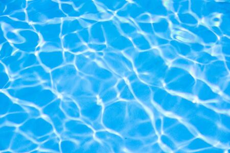 Water in swimming pool blue backgroundの写真素材