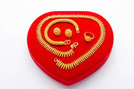 Precious Golden Jewelry Collection on Red Boxの写真素材