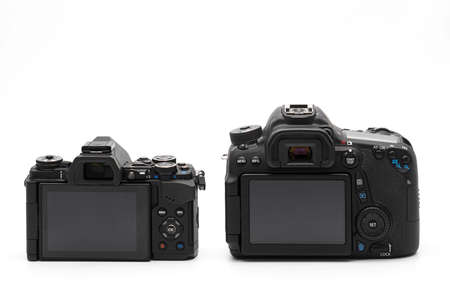 Closeup Back View of Mirrorless Camera and DSLR Camera Isolated on White Backgroundの写真素材