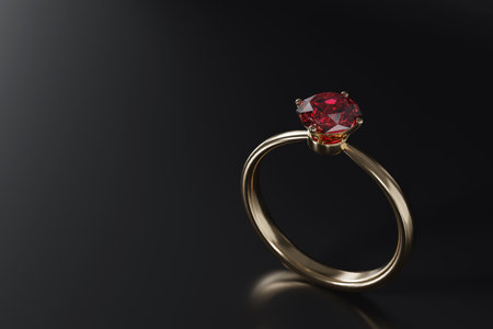 <p>Close-up red diamond ring isolated on dark background with copy space</p>の写真素材
