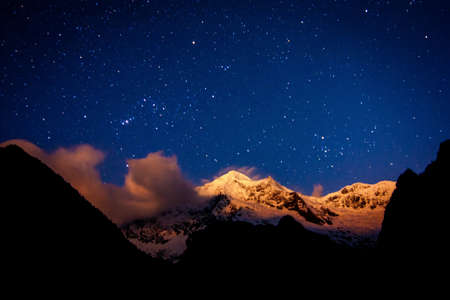 Snow Mountain in the night full stars of sky.の素材