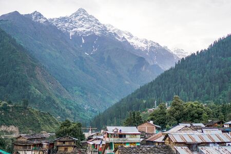 snow peak view on mountain from town of valleyの写真素材