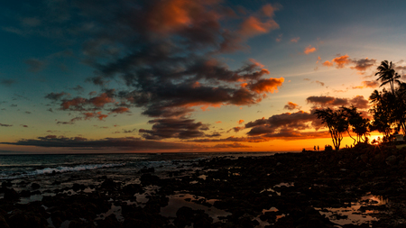Evening Sunset at a Tropical Rocky Beachの写真素材