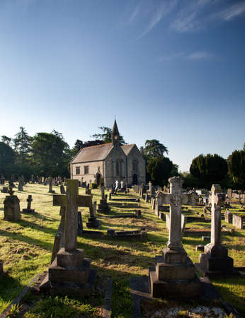 Graveyard stones with church in the backgroundの写真素材