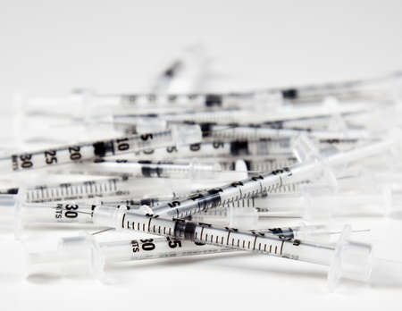 Pile of discarded injection syringes after immunizationの写真素材