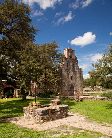 View of the garden and well in front of the Mission Espada near San Antonio in Texasの写真素材