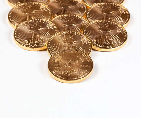 Golden Eagle coins forming a receding stack into the backgroundの写真素材