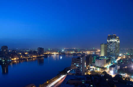 Smoggy evening panorama across Cairo in Egypt with the river Nileの写真素材