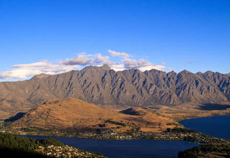 Remarables mountain range tower over Queenstown in New Zealandの写真素材