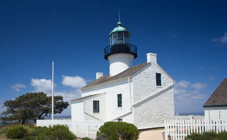 Old lighthouse on Point Loma near San Diego with a bright blue sky framing the shotの写真素材