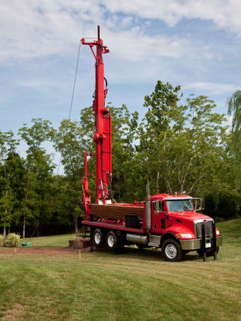 Drilling for geothermal power system in suburban yard Drilling for geothermal power system in suburban yard