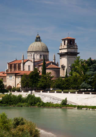River Adige in Verona, Italy with old church on bankの写真素材