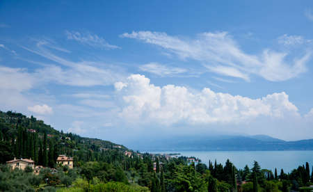 View of Lake Garda and Gardone from the hillside above the townの写真素材