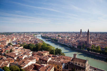 View over the rooftops of Verona, Italy as the sun is setting in the eveningの写真素材